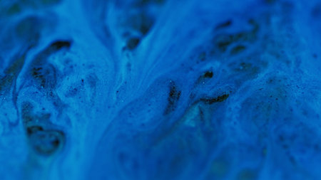 Wet glitter texture. Draw floating. Black blue color shimmering particles acrylic ink water marble blend wave abstract art background.の写真素材