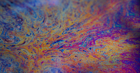 Oil fluid stain. Blur ink mix. Defocused multicolor purple green liquid paint curve acrylic slick on...