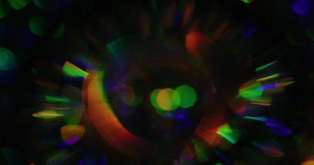 Bokeh crystal. Blur kaleidoscope light. Defocused leak multicolor green yellow rays rainbow flickers...