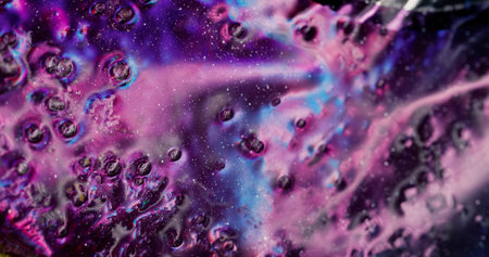 Oil fluid flow. Glitter texture. Defocused blue lilac color shimmering paint ink sparkling bright...