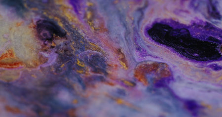 Ink mix. Paint blend wave. Defocused multicolor purple fluid shimmering gleaming flow marble texture bright particles moving on abstract art background.の写真素材