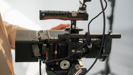 Video camera. Studio equipment. Closeup of professional filming recording device. Unrecognizable...