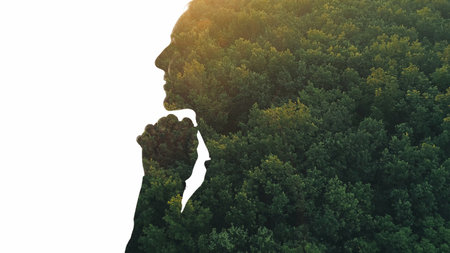 Nature inspiration. Environmental protection. Aerial view forest foliage in double exposure profile silhouette of grateful woman face isolated on white copy space background.の写真素材