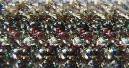 Christmas magic. Blur sparkling glow. Red golden yellow color gleaming lens flare bright flickers on abstract art bokeh light background.の写真素材