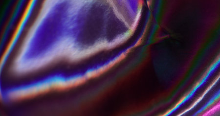 Radiant foil. Mix shade. Metallic ripple effect. Festive decorative hologram rainbow background. Closeup uneven texture abrupt color transition. Holographic flare fluid.の写真素材