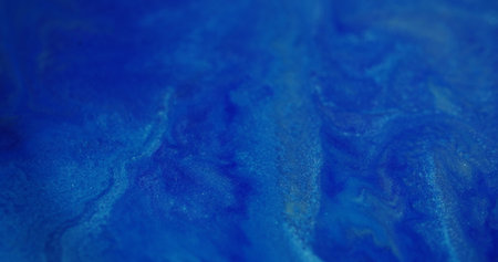 Wet ink texture. Blur paint flow. Blue white color blinking liquid shimmering dust moving on...