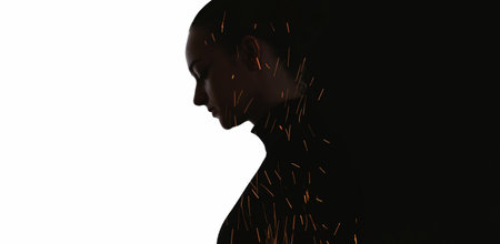 Anxious silhouette. Emotional burnout. Fire sparks in dark double exposure profile outline of exhausted woman isolated on white black empty space background.の写真素材