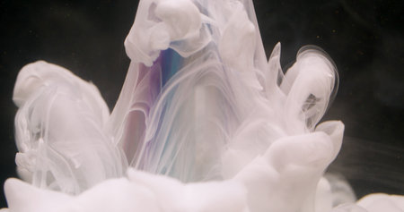 Water smoke. Paint splash. Defocused white colorful fog fluid texture pyramid floating on abstract...