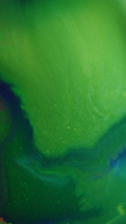 Splash ink. Mix color. Defocused green blue liquid chemical texture acrylic particle fluid dot...