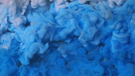 Abstract liquid paint. Color ink. Defocused blue smoke cloud splash water vapor fume fog texture on art light background.の写真素材