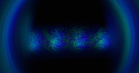 Gasoline fluid. Cosmic sphere. Blue green paint on round lens water surface. Defocused abstract background floating color drop texture.の写真素材