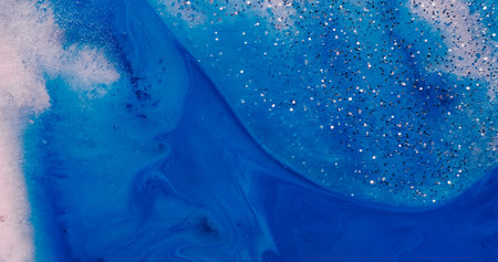Bubble paint. Shimmering flow. Oil art spot merge color blue liquid blur background. Glossy fluid abstract metal dust spill surface.の写真素材
