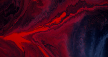 Bright marble. Colorful emulsion. Red gray black paint illuminated smooth lava stream spill hot dye...