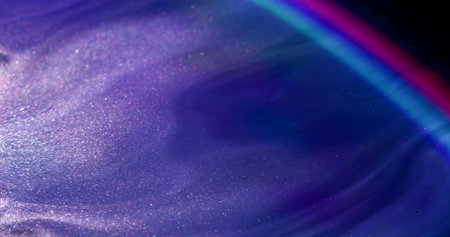Sparkling texture. Ink stream. Mystical shine violet fluid spill wet background. Neon blur light color strip abstract flow metal particles.の写真素材