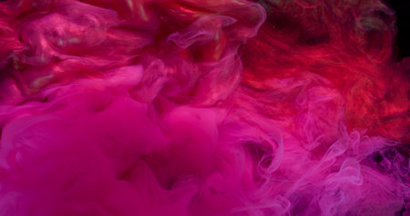 Smoke wave. Art fluid. Pink purple red shimmering neon paint explosion in water. Abstract fume splash color spill defocused background.の写真素材