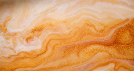 Acrylic mix. Paint drip. Defocused yellow golden white color shimmer wet texture gel emulsion wave pouring on abstract background.の写真素材