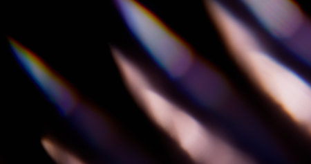 Blur glare. Rainbow background. Defocused blue yellow green colorful illuminated spectrum sparkle...