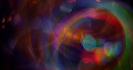 Defocused holiday decoration. Green color shining blinking particles lens flare motion on blurred bokeh light background.の写真素材