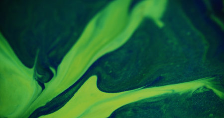 Paint green. Defocused futuristic flashes. Beautiful sparkling colorful liquid turning on blurred...