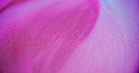 Paint glow. Defocused glitter fluid. Sparkling beautiful bright pink colorful flow motion on blurred bokeh light modern abstract background.の写真素材