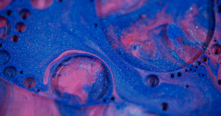 Sparkling flows. Defocused foam texture. Blinking beautiful blue paint water colorful bubbles turning on blurred bokeh light modern background.の写真素材