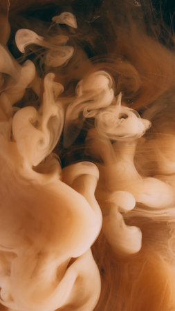 Smoke paint. Vapor cloud. Defocused yellow color splash ink in water explosion flow growing on...