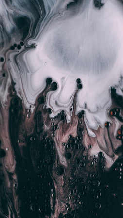 Drip texture. Marble fluid. Defocused white pink black color oil ink water bubbles blend spilling on abstract art dark black background.の写真素材