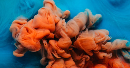 Ink drop explosion. Paint water. Defocused blue orange colorful ethereal splash chemical liquid...