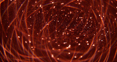 Blur color shine. Glitter flow. Defocused glow sparkling garland texture red light abstract art...
