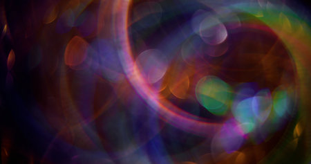Fluorescent circles. Defocused glittery sparkle. Colorful gleaming bright particles lens flare motion on abstract blurred modern background.の写真素材