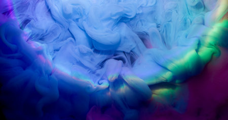 Color fog. Paint smoke. Whimsical blue luminosity wave dye liquid neon glowing mixing on dark abstract background water defocused circle lens.の写真素材