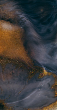 Ink spill. Sparkling liquid. Defocused black grey golden color shimmering wet paint mix flow texture...