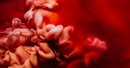 Smoke paint. Vapor cloud. Defocused purple orange color splash in water explosion particles flow...