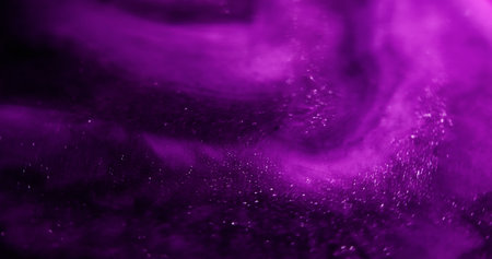 Neon glitter. Shimmer background. Purple fluorescent color flare illuminated swirling abstract bokeh light effect.の写真素材