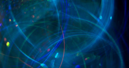 Colorful circles. Blurred festive flare. Blue optical kaleidoscope on abstract sparkling bokeh light...