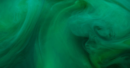 Paint background. Color smoke. Blur green water fume chemical glitter sparkling splash wet texture fluid floating on art abstraction.の写真素材