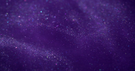 Glitter blur liquid. Violet stream. Color ink shiny art water cosmic emulsion. Defocused texture glowing particles mix abstract background.の写真素材