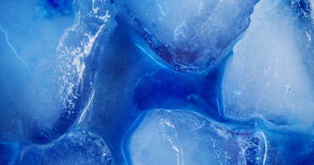 Ice rocks. Frost background. Defocused blue color sparkling droplets paint water floating on light creative acrylic cold abstraction.の写真素材