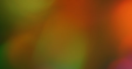 Lens flare. Optical blur transition. Bright color light flash on orange green abstract background....