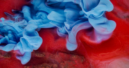 Swirling mist. Ink fluid. Defocused blue red colorful water texture smog acrylic flow floating on wooden bark abstract background.の写真素材