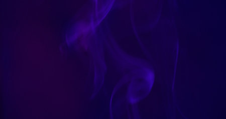 Paint background. Smoke flow. Defocused blue neon color vapor fog water texture pigment moving on abstract dark black abstraction.の写真素材