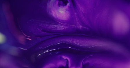 Acrylic fluid. Paint liquid. Defocused purple pink color chemical water splash pigment flowing spatter on abstract creative background.の写真素材