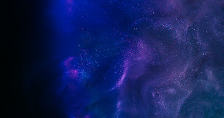 Purple ink. Shimmer background. Defocused yellow blue neon color swirling smoke fume liquid floating on dark black creative abstraction.の写真素材