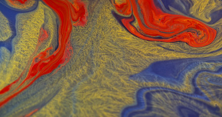 Twirl ink. Flowing wave. Defocused blue orange yellow color swirling liquid spreading on abstract creative acrylic art background.の写真素材