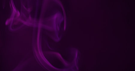 Cloud art. Paint flow. Blur purple neon color fog acrylic vapor water swirl pigment smog floating on abstract dark black background.の写真素材