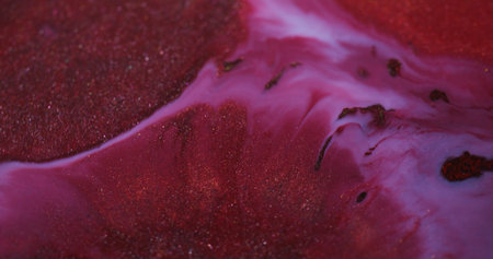 Color mix. Paint background. Defocused red purple pink chemical liquid flowing maroon stains floating on creative art abstraction.の写真素材