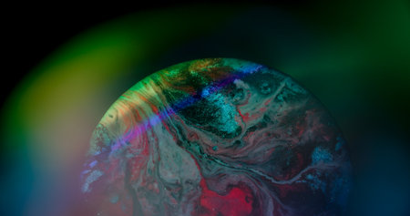 Sparkling wave. Neon bokeh. Defocused pink purple green color round paint glitter particles floating...