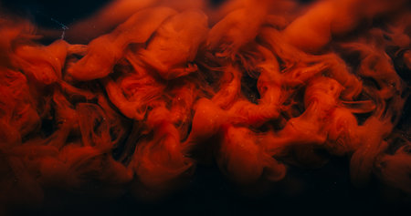 Paint drop. Fog background. Defocused bright red color swirling vapor fume liquid floating on dark black acrylic creative abstraction.の写真素材