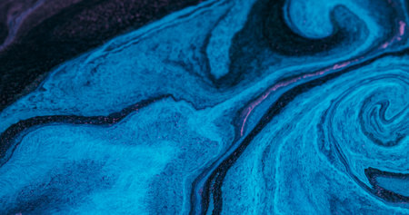 Acrylic spill mix. Light texture. Defocused blue purple colorful paint neon rainbow chemical fluid...