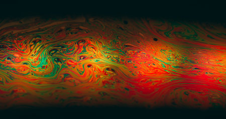 Psychedelic dye flow. Ink blur mix. Multicolor gasoline liquid vibrant wave pigment black background. Abstract red green blur glow.の写真素材